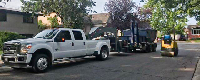 Picture of Quartz Construction Inc. work vehicles.